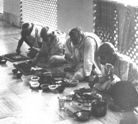 Srila Prabhupada and Srila Sridhara Maharaja taking prasadam together