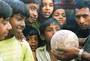 A Man Holding a Dinosaur Egg in Gujerat