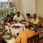 Devotees Honoring Prasadam