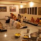 Devotees Honouring Prasadam