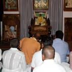 Devotees singing in front of Srila Sridhara Maharaja