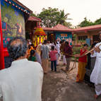 Murali-Krsna Dasa playing flute during rathotsava